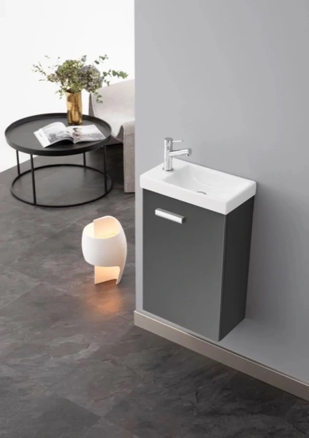 Lave mains compact suspendu avec meuble gris pour petit espace ou WC